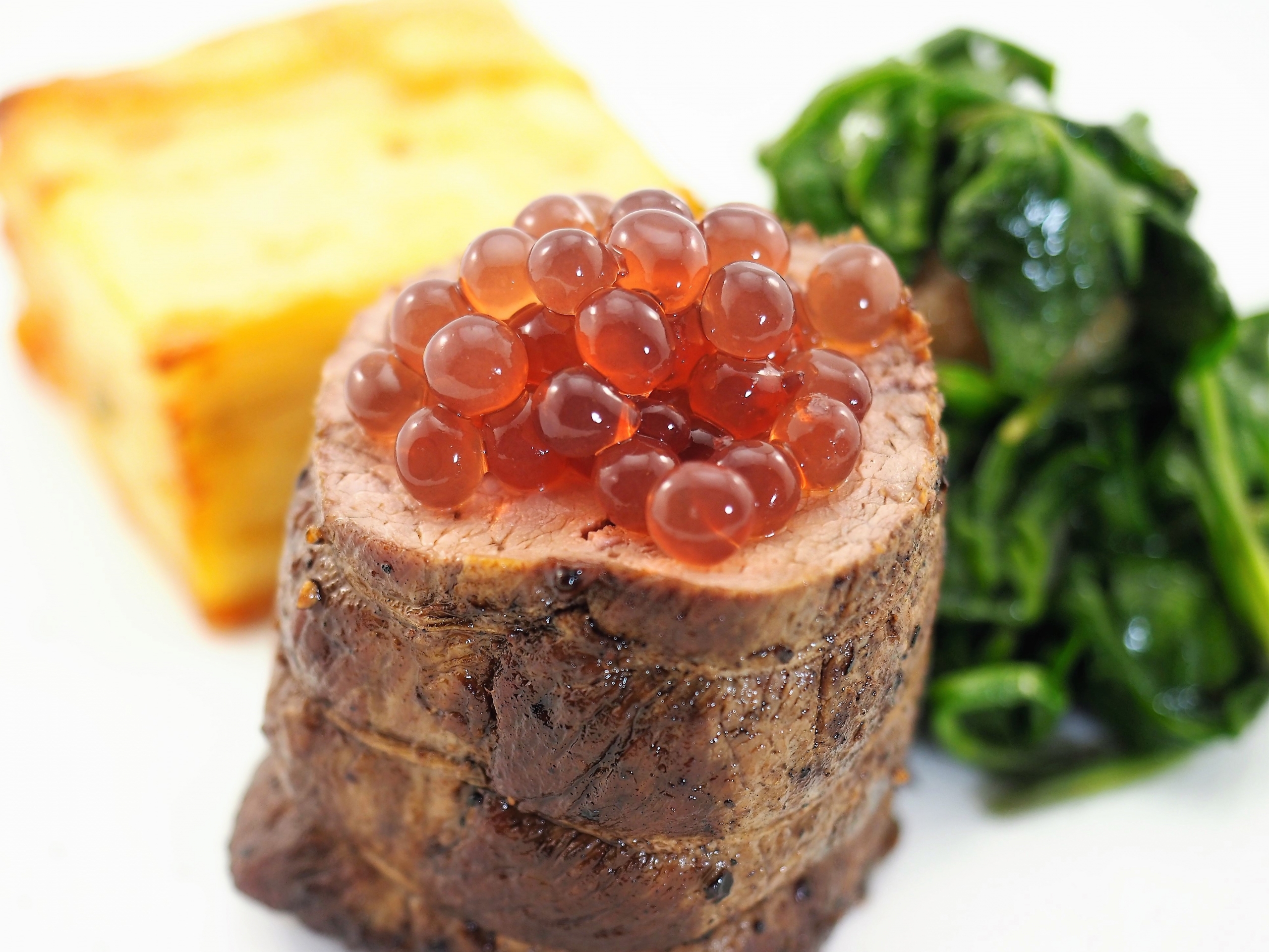 Lamb Loin with Pomme Anna Sauteed Spinach and Blackcurrant & Juniper Flavour Pearls