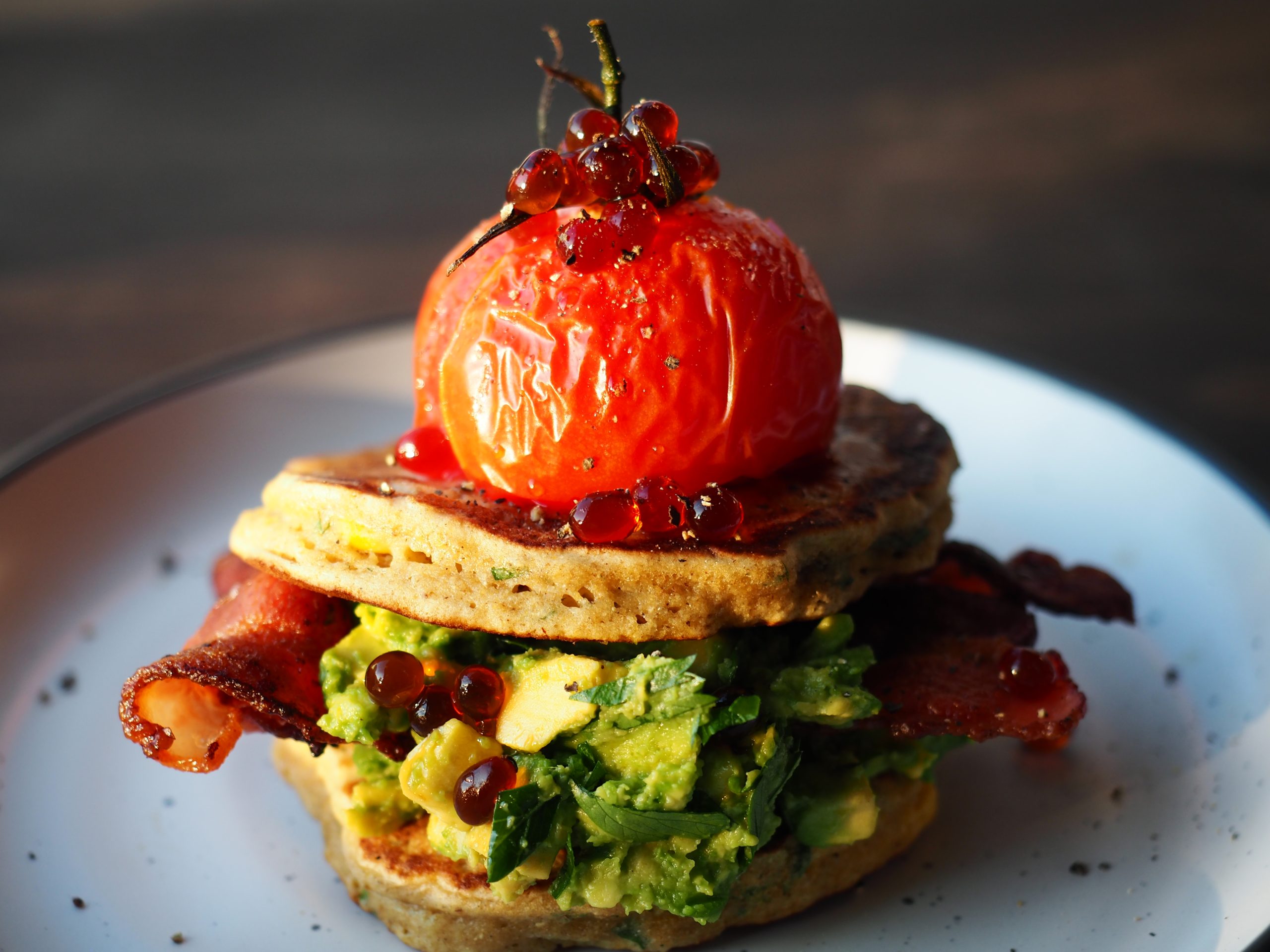 Corn Fritters with Roast Tomato Bacon Avocado and Balsamic Flavour Pearls