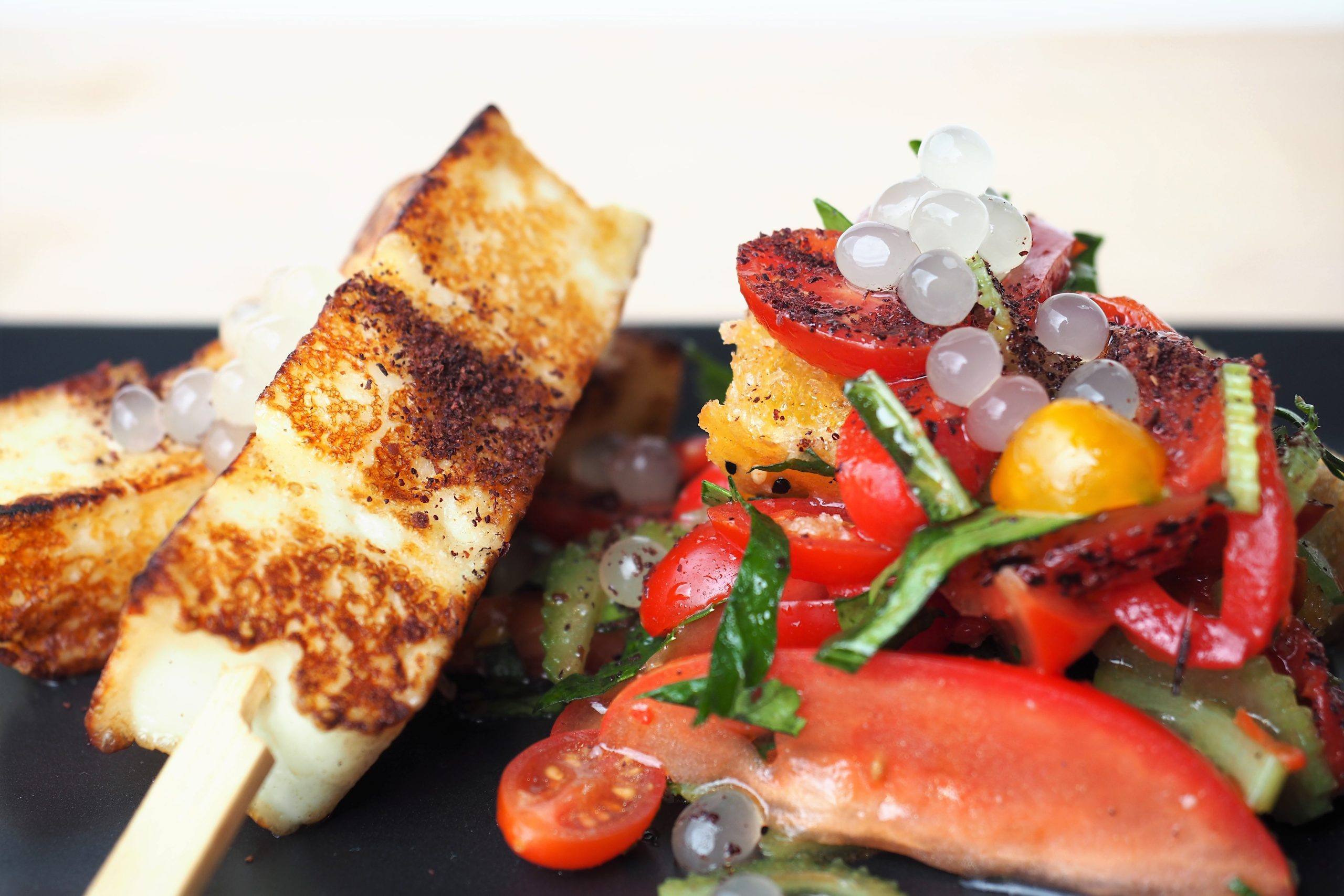 Halloumi Skewers with Tomato Salad and Yuzu Flavour Pearls.